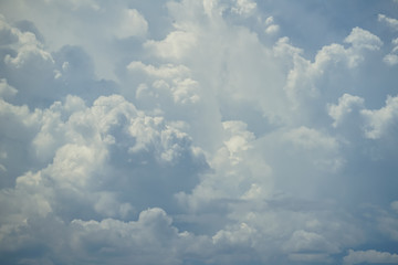 Wall Mural - abstract scene of powerful moving white cloud with shades of blue sky background