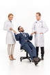© LIGHTFIELD STUDIOS - businessman giving money to doctors