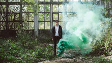 Young Man With Green Smoke Bomb