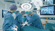 © Gorodenkoff - Medical Team Performing Surgical Operation in Bright Modern Operating Room