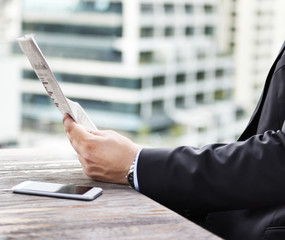 Wall Mural - businessman reading the financial news