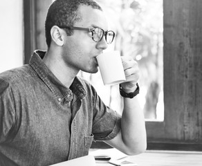 Wall Mural - a man having a cup of coffee