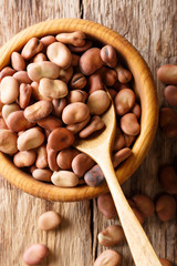 Poster - Natural broad beans close-up on a table. Vertical top view