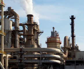 Industrial pipes and chimneys in a biomass, wood and paper factory