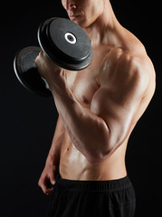 Wall Mural - close up of man with dumbbells exercising