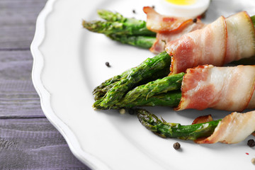 Sticker - Plate with bacon wrapped asparagus on table, closeup