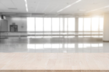 Wall Mural - top empty wood table on blurred abstract hallway background. can be used for display or montage your product.
