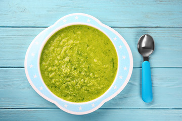 Poster - Plate of creamy baby vegetable soup on table