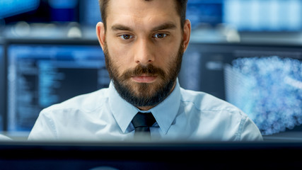 Wall Mural - neural network and machine learning engineer working hard at his workstation. multiple displays show
