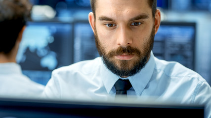 Wall Mural - neural network and machine learning engineer working hard at his workstation. multiple displays show