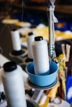 Spools Of Thread On An Industrial Sewing Machine