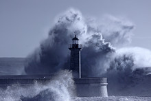 Lighthouse In The Middle Of Stormy Waves