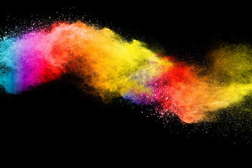 Wall Mural - Splash of colorful powder over black background.