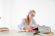 © dmitriisimakov - girl business Secretary reads books is preparing for the exam