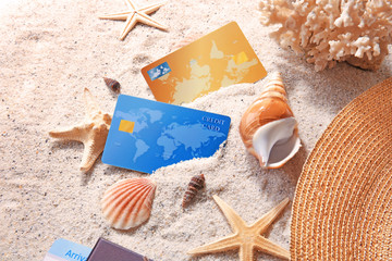 Sticker - Credit cards and shells on sand