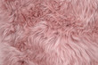 Pink sheepskin rug background sheep fur Wool texture