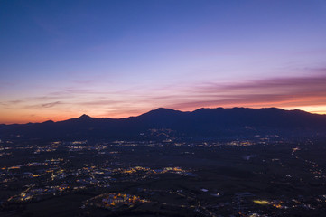 Wall Mural - Aerial view of an incredible sunset behind the Italian mountains