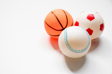 Group of football, baseball and basketball placed on white background