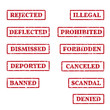 A set of rubber stamps on a themes: rejected, denied, banned, deported, scandal etc.