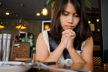 Wall Mural - woman praying in morning. Hands folded in prayer