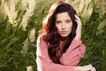 Wall Mural - portrait of a beautiful woman in an autumn sweater.