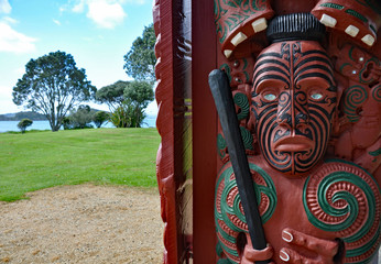 Wall Mural - Entrance carving at Maori war canoe house