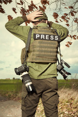 Wall Mural - Relax moment for photographer in war conflict field zone 