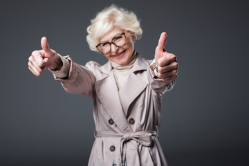 Wall Mural - senior woman with thumbs up