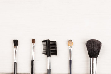 Items for make up on a white background, top view, copy space