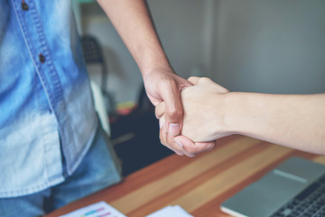 Joint Hands of Two Businessmen After Negotiating a Successful Business Agreement, And the handshake together. This is to promote cooperation in the joint business. Teamwork planning