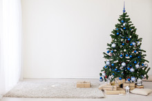 Christmas Tree With Blue In A White Room With Toys For Christmas