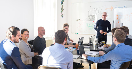 Wall Mural - relaxed informal it business startup company meeting. team leader discussing and brainstorming new a