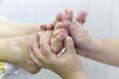 © ALEXEY - Foot massage. Foot massage in the patient. The doctor does the massage of the feet, heels and toes on the legs