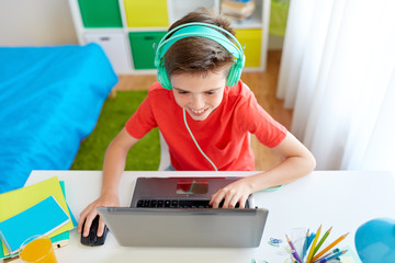 Sticker - boy in headphones playing video game on laptop