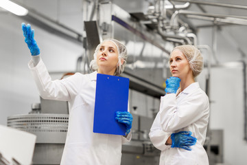 Wall Mural - women technologists at ice cream factory