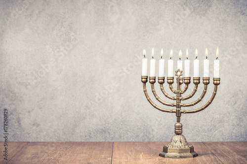 Bronze Hanukkah Menorah With Burning Candles On Wooden Table Front Old Vintage Concrete Wall Background Holiday Greeting Card Concept Retro Instagram Style Filtered Photo Kaufen Sie Dieses Foto Und Finden Sie