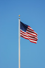 Wall Mural - Waving USA flag at flag pole 