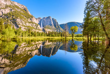 Yosemite National Park - Reflection In Merced River Of Yosemite Waterfall And Beautiful Mountain Landscape, California, USA