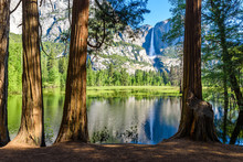 Yosemite National Park - Reflection In Merced River Of Yosemite Waterfall And Beautiful Mountain Landscape, California, USA
