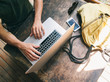 © Marija Savic/Stocksy - Man Working on Laptop at his Desk