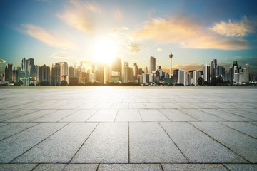 Wall Mural - Cityscape with empty brick floor ,sunset sunrise scene .