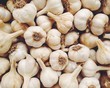 © Greg Schmigel/Stocksy - Fresh garlic at a vegetable market