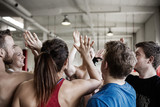 Successful People Giving High Five To Each Other In Gymnasium