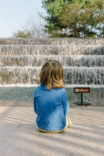 Young Boy Visiting The FDR Memorial In Washington DC