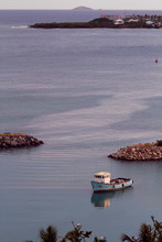 Image Of Small Blue Tugboat On The Sea In The Caribbean
