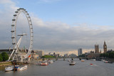 Fototapeta Londyn - View of London Eye, Southwark, Palace of Westminster and Big Ben at sunset from Golden Jubilee Bridges