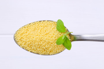 Sticker - spoon of raw couscous