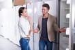 © JackF - Young couple looking at fridges in appliances shop