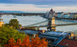 Budapest, Hungary - Sunrise over Budapest with Szechenyi Chain Bridge, Parliament and colorful autumn trees