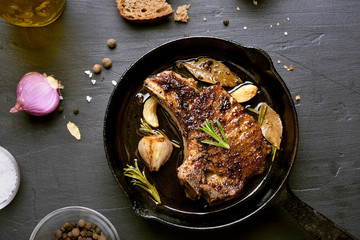 Wall Mural - Pork steak in frying pan, top view